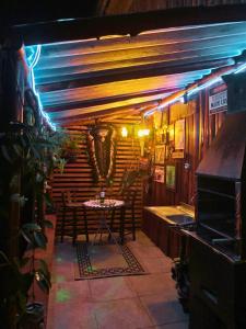 a room with a table and chairs in a restaurant at Propriedade inteira e Kombi-home em meio à mata in Rancho Queimado +41 photos