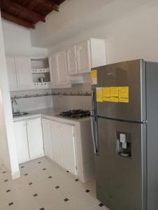 Kuchyň nebo kuchyňský kout v ubytování Apartamento coral