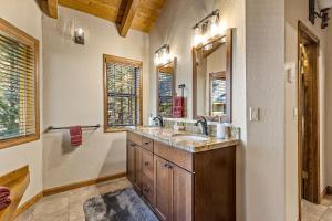 a bathroom with a sink and a mirror at Burning Tree in Flagstaff +44 photos