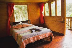 Postel nebo postele na pokoji v ubytování Hotel Campestre Rocas Del Paraíso