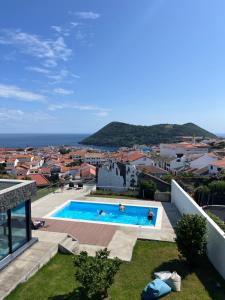 a swimming pool on the roof of a house at Retiro dos Ingleses in Angra do Heroísmo