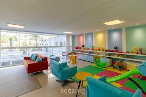 a childrens room with a play area with a slide at Apto c/ Churrasqueira em Cond. c/ Piscina BRI0102 in Florianópolis