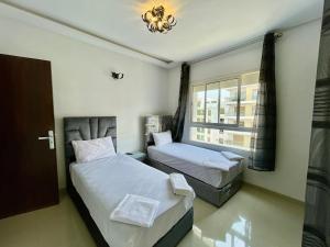 Katil atau katil-katil dalam bilik di Prestigia Luxury Apartment - Champs de Course, Fes Center