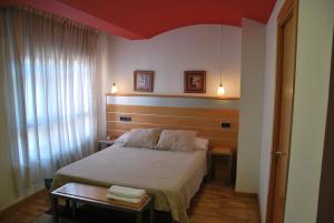 Postel nebo postele na pokoji v ubytování Hotel Trefacio