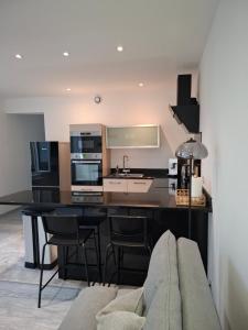 Η κουζίνα ή μικρή κουζίνα στο Appartement cosy proche centre-ville +12 φωτογραφίες