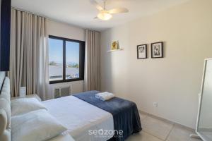 Giường trong phòng chung tại Aptos em Condo. com Piscina em Floripa - GVM