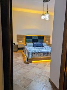 a bedroom with a king sized bed in a room at Marina Smir Compounds Pool & Beach in Marina Smir