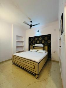 a bedroom with a large bed in a room at Amrit Ganga Homestay 1,5 km from kashi vishwanath Near Rathyatra ropeway in Varanasi