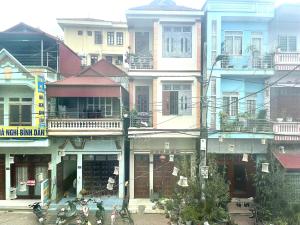 a group of tall buildings in a city at Bảo Bảo guest houes in Bắc Hà