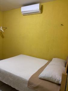 En eller flere senge i et værelse på Mi hogar feliz + 2 billeder