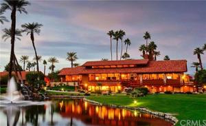 a large building with a pond in front of it at Spectacular View Just Steps to Pool and Jacuzzi at Sunrise Country Club in Rancho Mirage