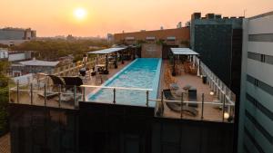a swimming pool on top of a building at Five Hotel & Residences in Asuncion