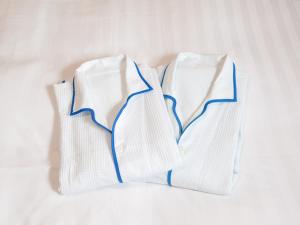 three white socks sitting on a white table at Comfort Hotel Sakai in Sakai