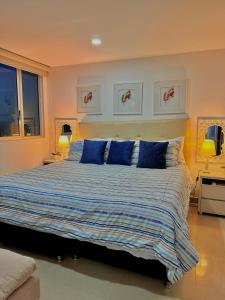 Postel nebo postele na pokoji v ubytování Piso 30 vista al mar, Palmetto 1 Bocagrande