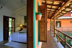 En eller flere senge i et værelse på Pousada Forte Rocha + 59 billeder