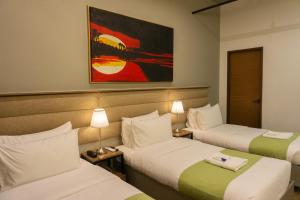 Katil atau katil-katil dalam bilik di Avioré Hotel Tacloban