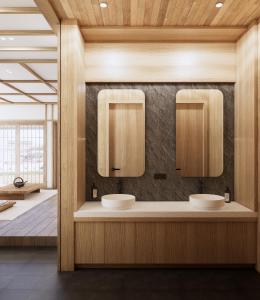 TimuranにあるAmani Suites Yogyakartaの洗面台2つとバスルーム1つを備えたバスルーム