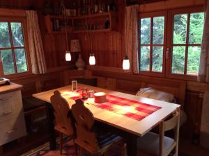 a kitchen with a table with a checker board on it at Schalale in Kanzelhöhe