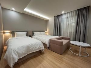Postel nebo postele na pokoji v ubytování Hound Hotel Ulsan Haksan