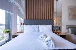 Ένα ή περισσότερα κρεβάτια σε δωμάτιο στο G15 Apartments by Vibrant +63 φωτογραφίες