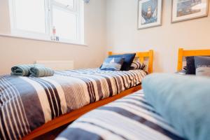 En eller flere senge i et værelse på Edith Cottage, Saundersfoot