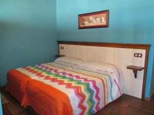 Łóżko lub łóżka w pokoju w obiekcie Apartamentos Trinidad