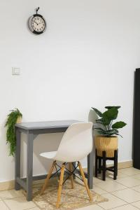 a white chair sitting in front of a desk at Amirah Homes in Machakos +21 photos