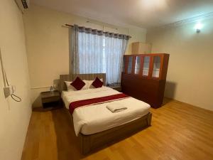 Postel nebo postele na pokoji v ubytování Hotel Jigmeling Appartments