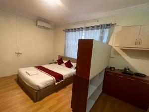 Postel nebo postele na pokoji v ubytování Hotel Jigmeling Appartments