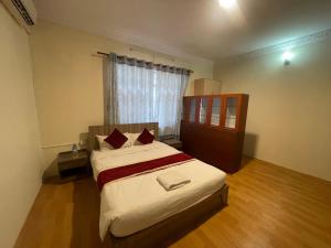 Postel nebo postele na pokoji v ubytování Hotel Jigmeling Appartments