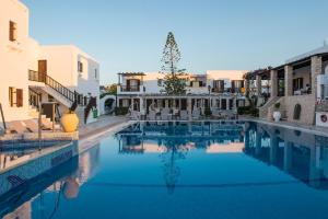 a large swimming pool in the middle of a building at Contaratos Beach Hotel in Naousa