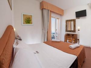 Postel nebo postele na pokoji v ubytování Hotel Dea