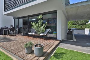 Κήπος έξω από το Modernes Studio-Apartment - Gartenblick