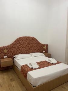 Letto o letti in una camera di Leoni di Sicilia