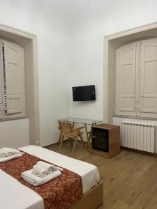 Letto o letti in una camera di Leoni di Sicilia