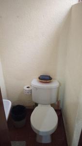 a bathroom with a white toilet with a blue towel on it at Departamento C-3 in Mexico City