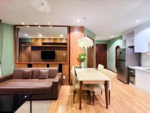a living room with a couch and a table at Condo 2BR City Center - The 2nd Home in Da Lat +12 photos