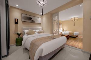Beijing Le Zai Nan Luo Gu Xiang Wang Fu Jing Forbidden City Courtyard Hotel&Free laundry service&Free coffee &Paid Dumpling experience service客房内的一张或多张床位
