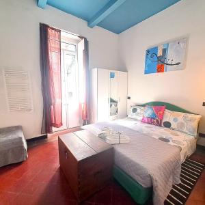 a bedroom with a large bed with a wooden table at Flat Liberty Turin center Porta Susa, reserved parking in Turin