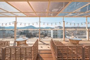 a balcony with chairs and a view of a city at Gridt Hotel & Home in Gyeongju