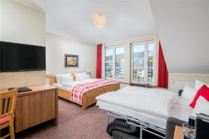 Ein Bett oder Betten in einem Zimmer der Unterkunft Best Western Hotel Brunnenhof