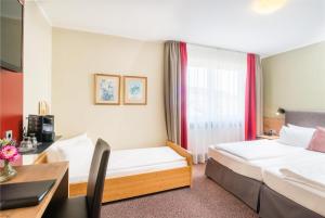 Ein Bett oder Betten in einem Zimmer der Unterkunft Best Western Hotel Brunnenhof