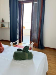 Postel nebo postele na pokoji v ubytování B&B Al Vecchio Pontile kitesurf
