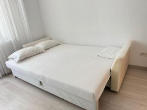 Postel nebo postele na pokoji v ubytování Apartament Tomis Nord