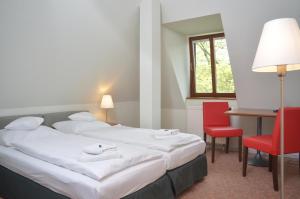 Ένα δωμάτιο στο Hotel & Apartments Fürstenhof am Bauhaus