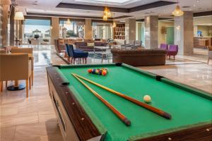 a pool table in a hotel room with pool balls at Sol Guadalmar in Málaga