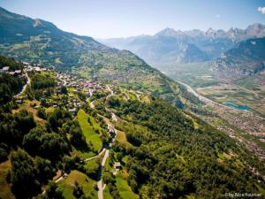 an aerial view of a village in the mountains at Charming apartment with hill view in Veysonnaz