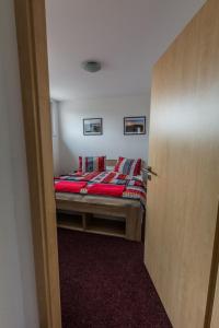 Posteľ alebo postele v izbe v ubytovaní Apartmány Vilma