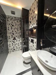 a bathroom with a toilet and a sink at The Divine Villa! in Indore