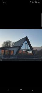 a picture of a house with a roof at A 3 villa in Nucşoara